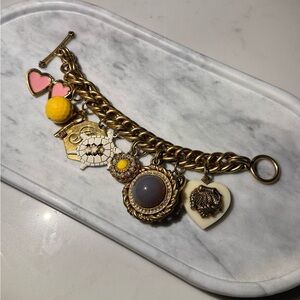 Juicy Couture Gold Charm Bracelet with Pink and Yellow Accents